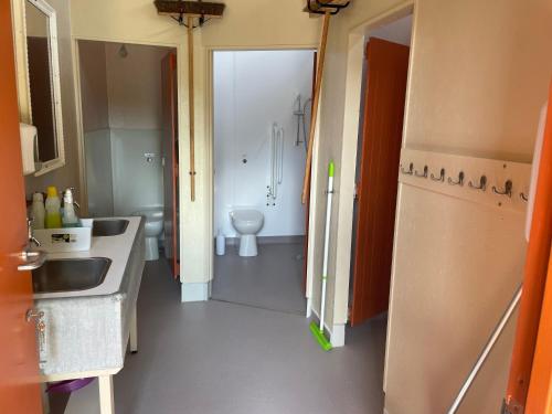 a bathroom with a sink and a toilet at Lydeard Farm Bush Camp & Lodges in Bridgwater
