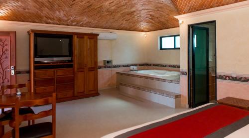 Ένα μπάνιο στο HOTEL & SPA HACIENDA TRES VIDAS