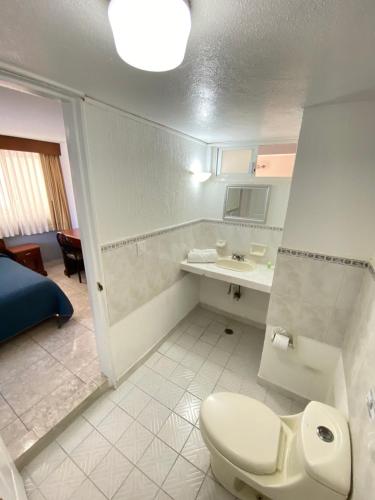 Koupelna v ubytování Hotel Qualitel Plus