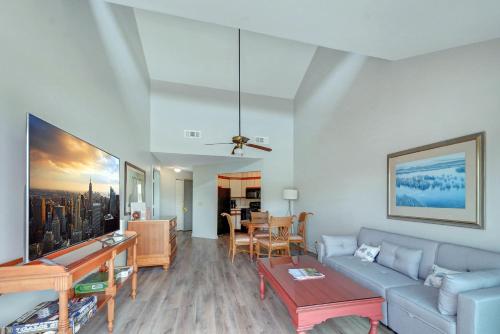 a living room with a couch and a table at 294 Moss Oak Circle in Saint Simons Island