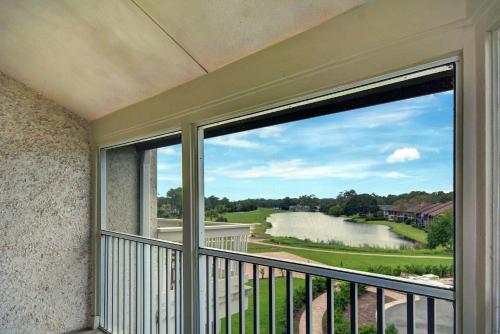 a balcony with a view of a river at 294 Moss Oak Circle in Saint Simons Island