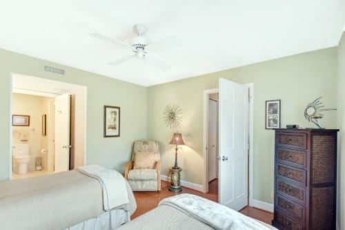 a bedroom with two beds and a dresser at Harbour Oaks 312 in Demere Park
