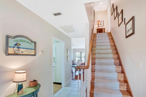 a staircase in a home with white walls at Harbour Oaks 312 in Demere Park