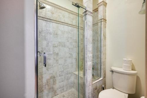 a bathroom with a glass shower with a toilet at Historic Chambersburg Home with Pool and Game Rooms! in Chambersburg