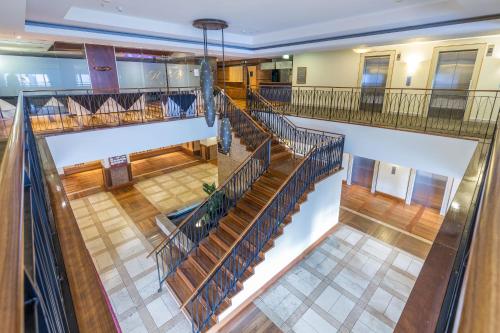 an overhead view of a large building with stairs at Royale Palace - Rooftop Pool &Spa in Auckland