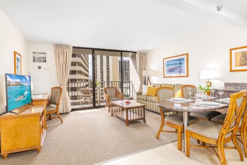 a living room with a couch and a table at Cozy & Diamond Head View at Waikiki with Parking in Honolulu