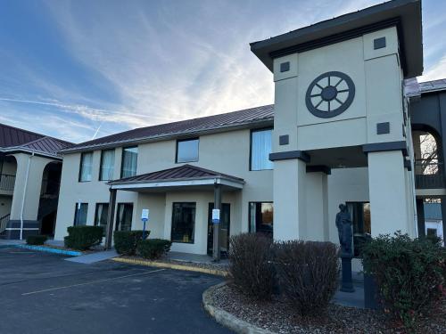 a building with a clock on the side of it at Quality Inn in Ashland