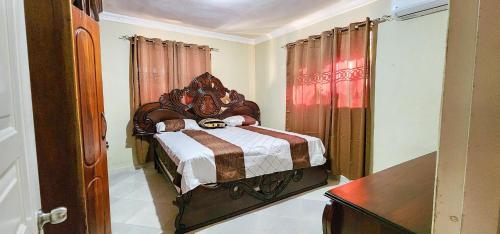 Säng eller sängar i ett rum på casa bayaguana