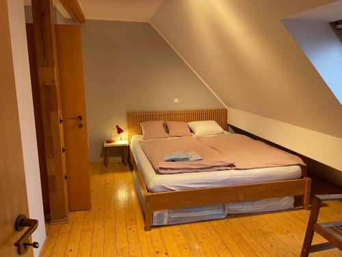 a bedroom with a bed in an attic at Byt na půdě kousek od hradu in Prague