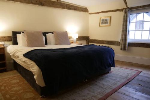 a bedroom with a large bed in a room at The Butcher's Block in Puckeridge