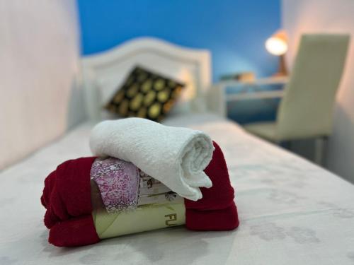 a towel on top of a book on a bed at Bachelor Partition Room in Tecom in Dubai