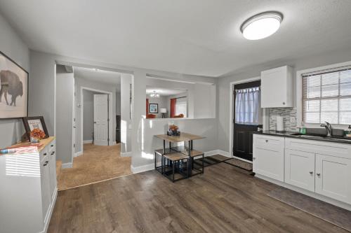 a kitchen with white cabinets and a table at 3BR free parking free Wi-Fi near dntown St Paul in Saint Paul