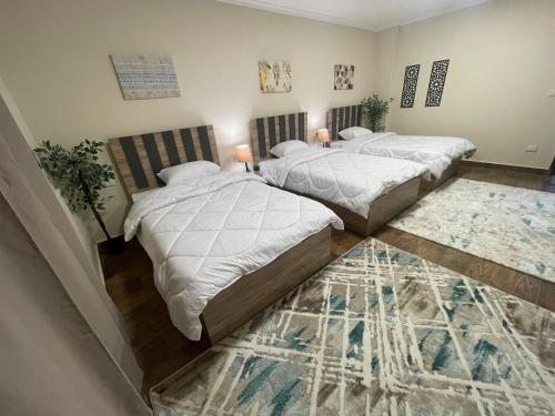 Postel nebo postele na pokoji v ubytování Malek Pyramids Guest House