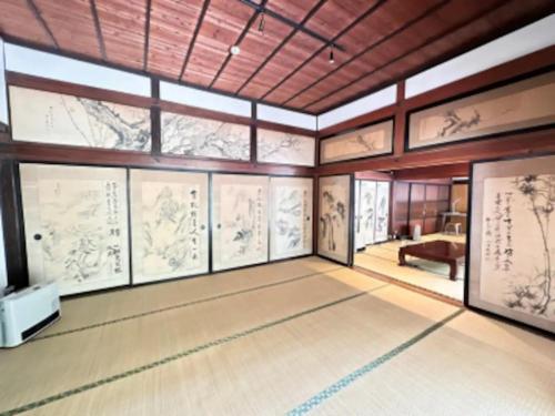 a room with many drawings on the walls at Potato mura house tatara - Vacation STAY 90000v in Nagano