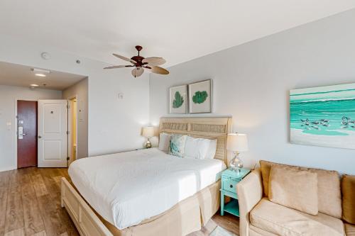 a bedroom with a bed and a couch at Luau 6834 in Destin