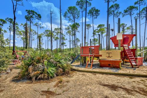 a playground with colorful play equipment in a park at Luau 6834 in Destin