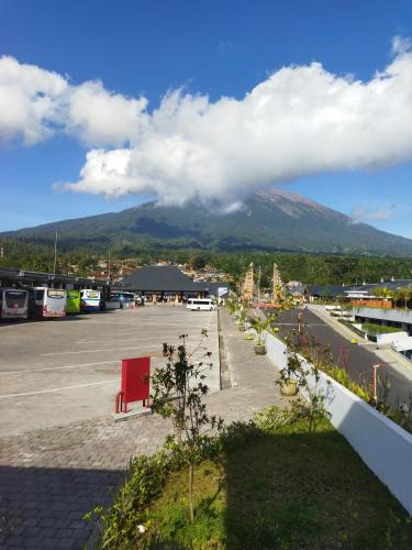 a parking lot with a view of a mountain at Wahwik's House in Ubud
