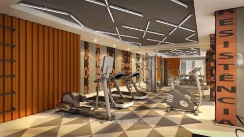 a gym with several treadmills and elliptical machines at Ap smart Campinas in Campinas
