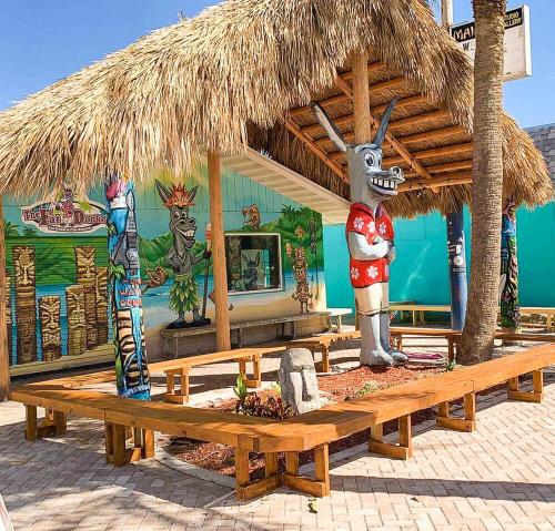 a pavilion with a statue of a donkey and a mural at Beach Bungalow By The Sea 1 in Cocoa Beach