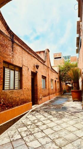 an empty alley in an old brick building at Titos Centric Home in Morelia