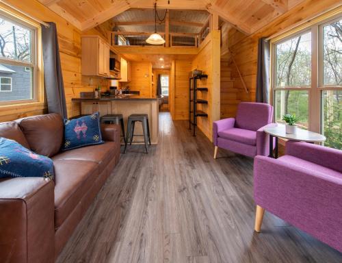 a living room with a couch and chairs in a log cabin at Luke Cabin Escape To Our Luxury Hot Tub Cabin in Chattanooga