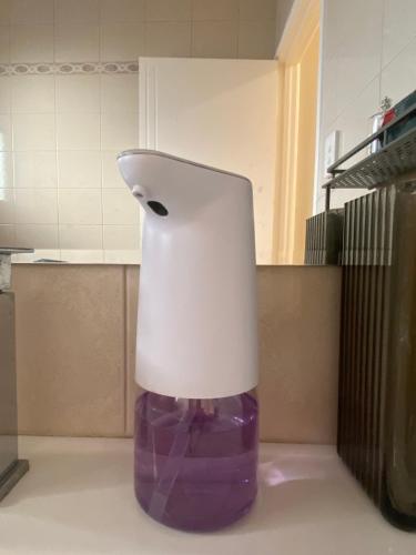 a white and purple object sitting on the floor in a kitchen at Sunny Ocean View Retreat in Perth