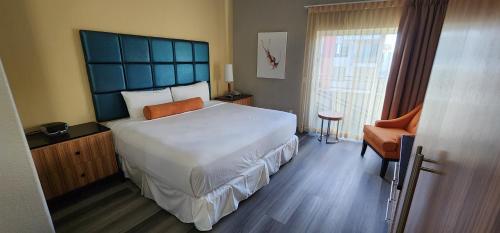 Ένα ή περισσότερα κρεβάτια σε δωμάτιο στο Porto Vista Hotel In Little Italy