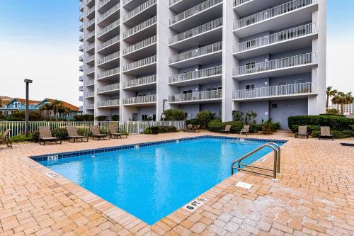 a swimming pool in front of a large apartment building at South Harbour 2A in Pensacola Beach