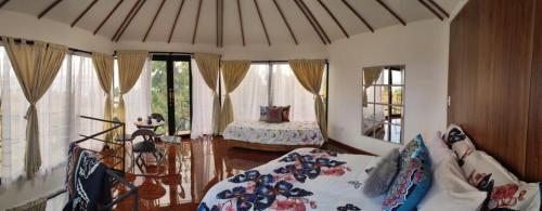 Postel nebo postele na pokoji v ubytování GLAMPING Aldea Muisca