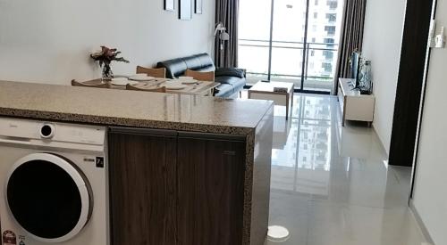a living room with a washing machine and a living room at Forest森林城市01 in Kampong Pok Kechil