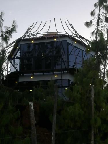 a round building with lights on top of it at GLAMPING Aldea Muisca in Tota