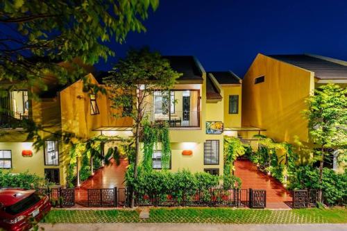 a house with a car parked in front of it at Lotus Villa Hoi An - 4 Bedrooms - river view - private pool in An Bang