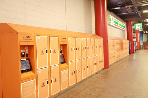 a row of lockers in a hallway in a building at Nest Apartments on Rose Lane in Melbourne