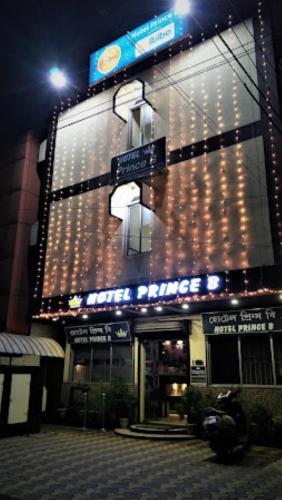 a large building with lights on it at night at Hotel Prince B Guwahati in Guwahati