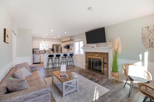 a living room with a couch and a fireplace at Cozy 2BR Townhome - 1 and a Half Bath - Sleeps 5 - Walk to Old Town Arvada in Arvada