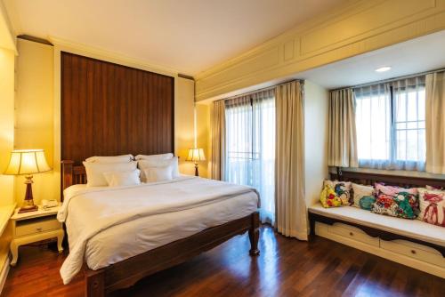 Postel nebo postele na pokoji v ubytování Chankam Boutique Hotel
