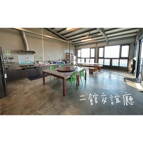 a large kitchen with a table in a room at 星森林包棟住宿-台中東勢-山區景觀 in Dongshi
