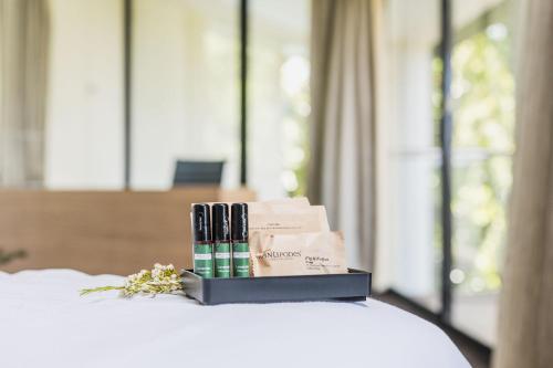 a box of candles sitting on top of a bed at Crowne Plaza Canberra by IHG in Canberra