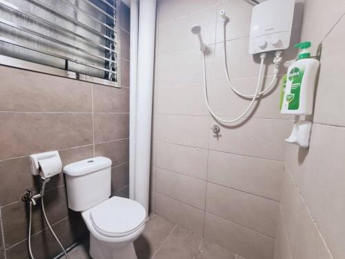 a bathroom with a toilet and a shower at New! 4-7pax 2bedrooms condo near Mount Austin JB in Johor Bahru