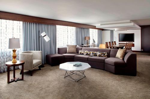 a living room with a couch and a table at Raleigh Marriott Crabtree Valley in Raleigh