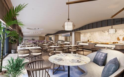 a rendering of a restaurant with tables and chairs at Grand Mercure Minamiboso Resort & Spa in Minamiboso