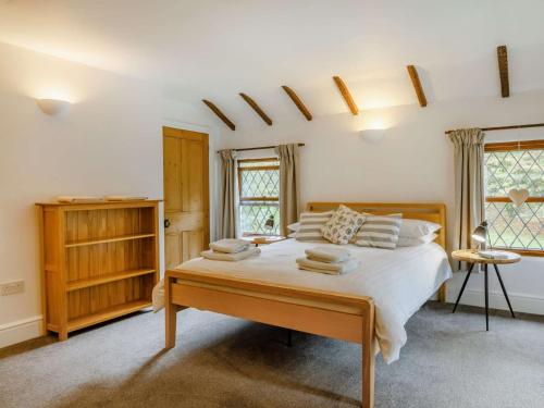 a bedroom with a large bed in a room at 2 Bed in Woolacombe 28803 in Bittadon