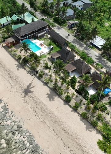 an aerial view of a resort on the beach at Yapak Beach Villas in San Isidro