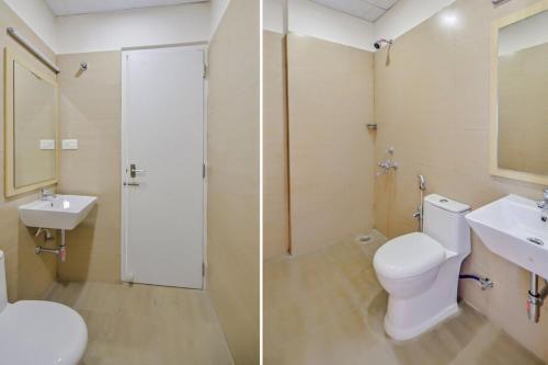 uma casa de banho com um WC, um lavatório e um chuveiro em THE PARADISE INTERNATIONAL em Coimbatore