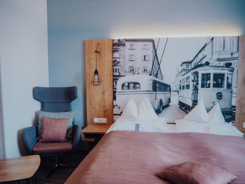 a bedroom with a bed and a picture of a tram at Levy's Rooms & Breakfast in Salzburg