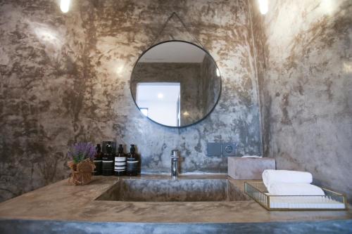 a bathroom with a sink and a mirror at Villa Valeria in Ungasan