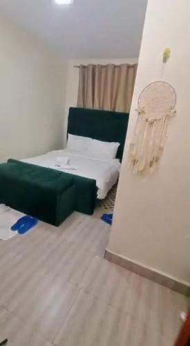 Postel nebo postele na pokoji v ubytování BnB Sangara, Nakuru