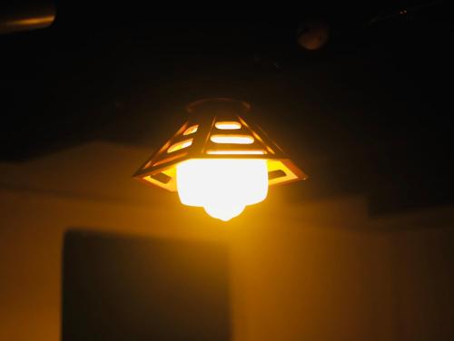 a lit up lamp in the dark at Paroommel Haven Wayanad in Kenichira