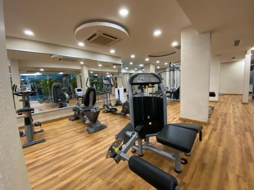 a gym with several treadmills and cardio machines at Elegance Resort Hotel & SPA Wellness-Aqua in Yalova