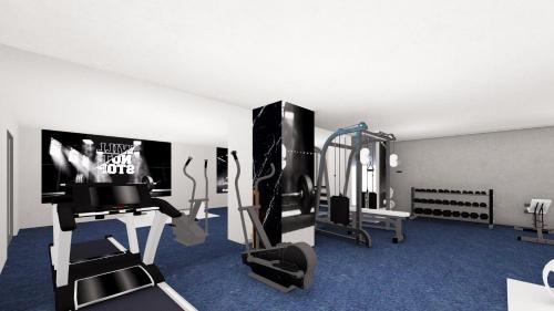 a room with a gym with a treadmill at duqqan deluxe hotel in Kusadası